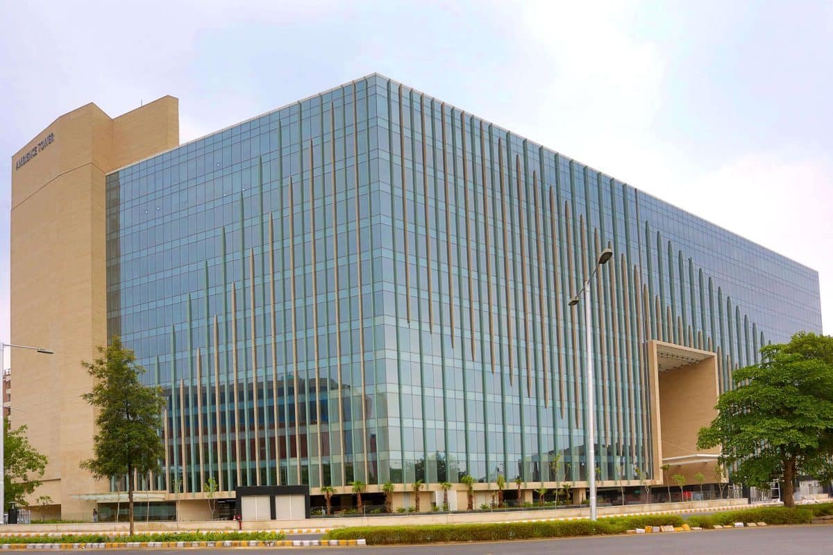 Commercial office building with glass facade in Gurgaon built by a commercial construction company